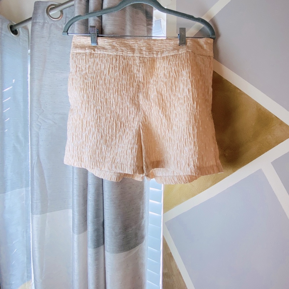 Peach and white detailed shorts.